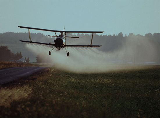 airplane-spraying-fields-with-herbicide